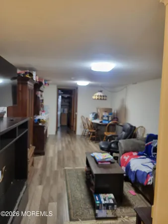 a living room with furniture a ceiling fan and a rug