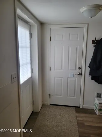 a view of a closet area with an empty room