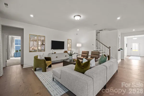 a living room with fireplace furniture and a flat screen tv