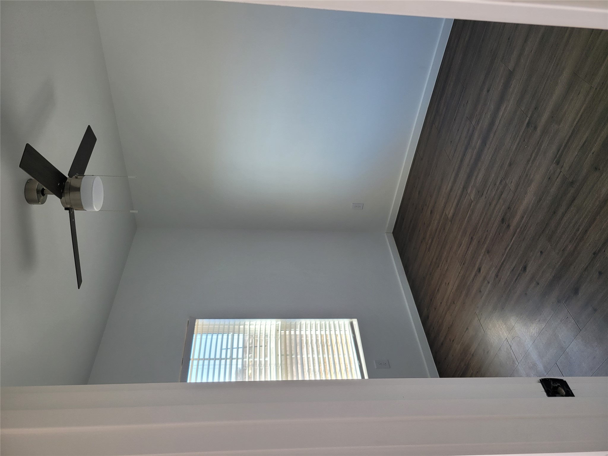 422 A Road Stockdale, TX 78160 - Photo 35 of 40 Laminate flooring and a window with blinds define this versatile room.