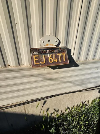a view of a hallway with furniture and a window