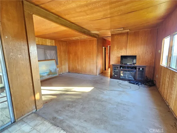a room with gym equipment and a large window