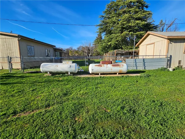 a view of a backyard of the house