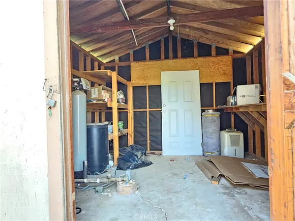 a view of a house with a large tree