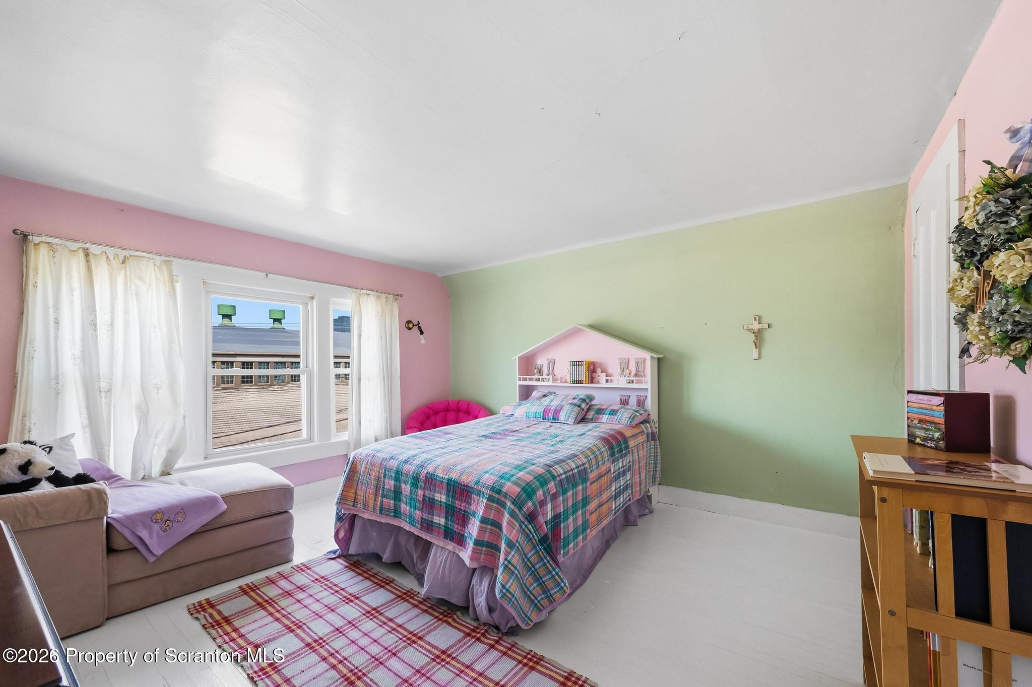 616 Myrtle Street Scranton, PA 18510 - Photo 41 of 65 a bedroom with a bed wooden floor and window