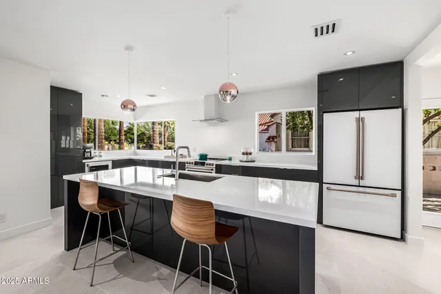 a kitchen with a sink cabinets and window