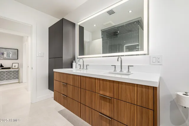 a white bath tub sitting next to a bathroom