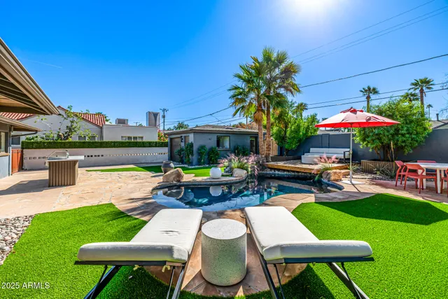 a view of swimming pool with a patio