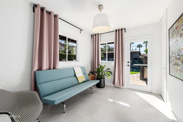 a bathroom with a shower a sink and mirror