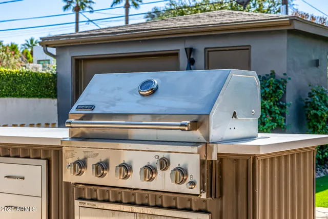 a view of a water fountain in a backyard