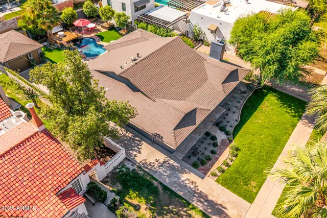 an aerial view of houses with outdoor space