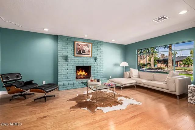 a bed room with furniture and a flat screen tv