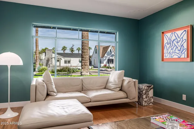a large kitchen with stainless steel appliances a sink and a refrigerator