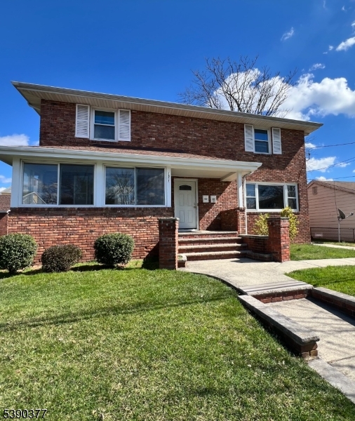 1575 Lenox Place, Unit 2 Rahway, NJ 07065 - Photo 11 of 12 a front view of a house with garden