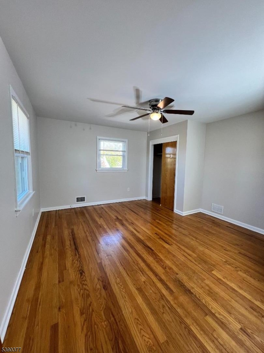 1575 Lenox Place, Unit 2 Rahway, NJ 07065 - Photo 5 of 12 a view of empty room and wooden floor