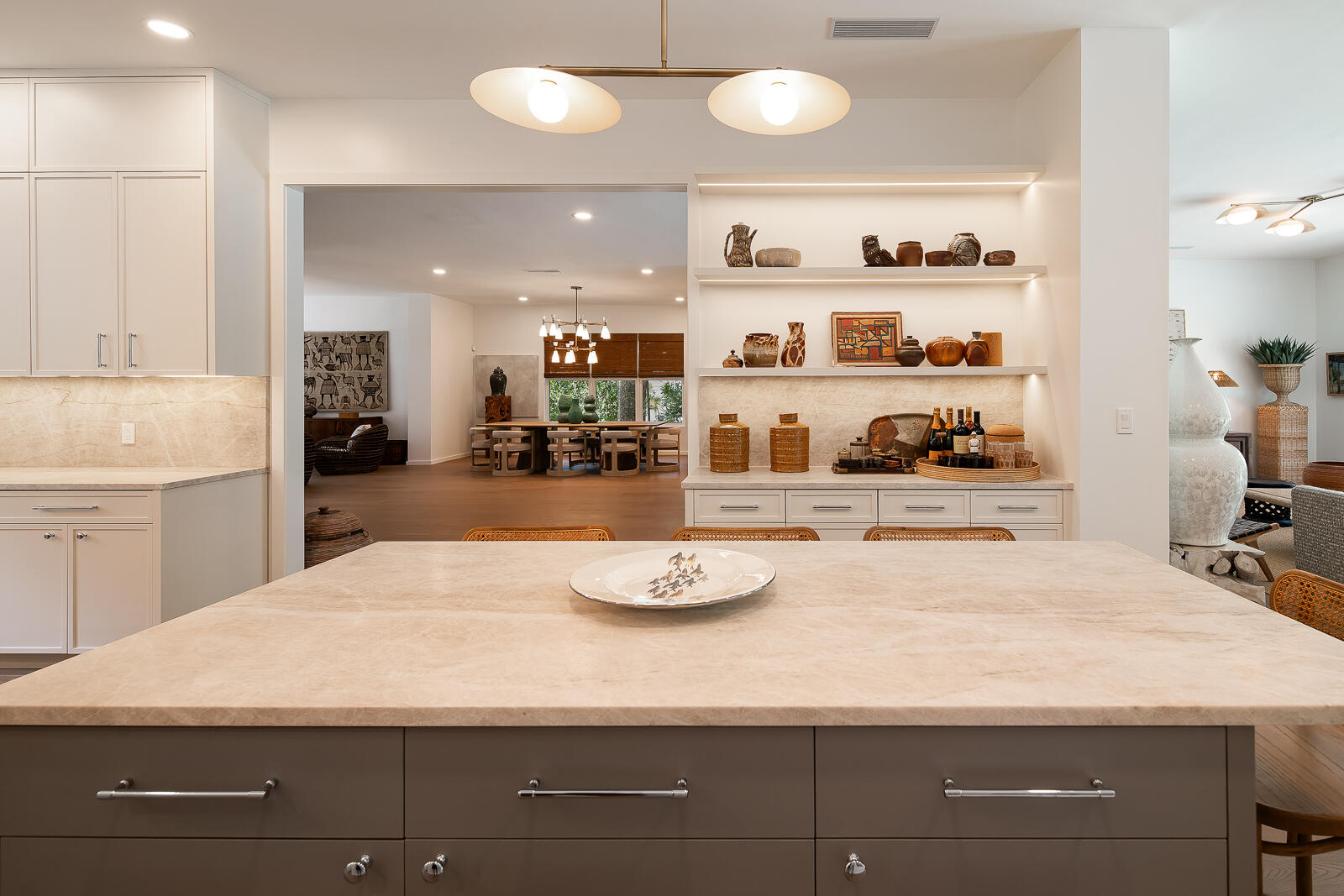 6371 Southwest 87th Terrace Pinecrest, FL 33156 - Photo 11 of 16 a kitchen with a sink a stove and white cabinets with wooden floor