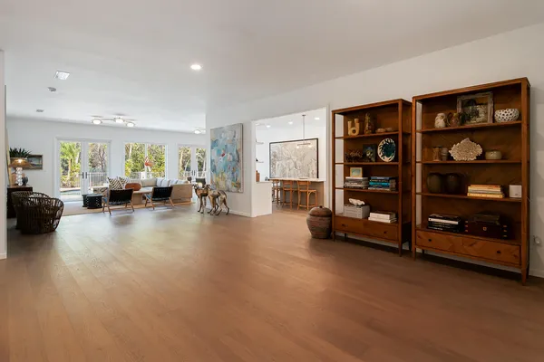 a living room with furniture and gym equipment