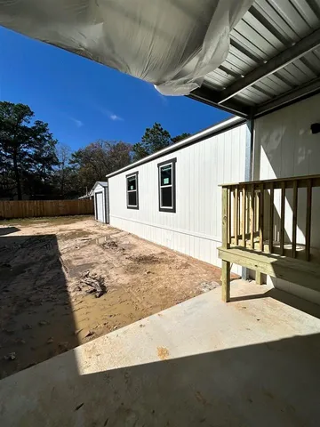 a view of a backyard of the house