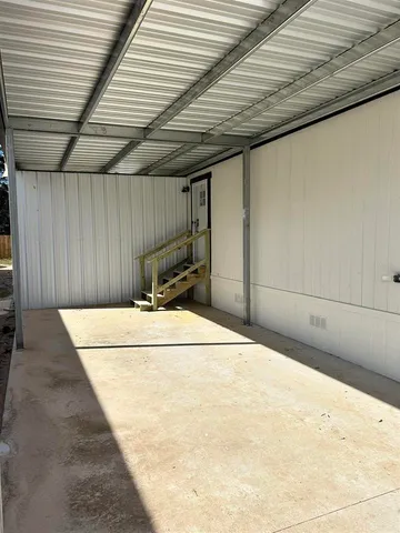 a bed room with a bed and a wooden roof