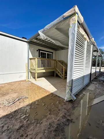 a view of a wooden door with a tree
