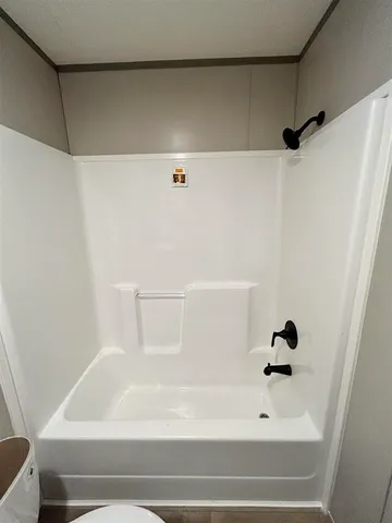 a view of a bathroom with a sink and mirror