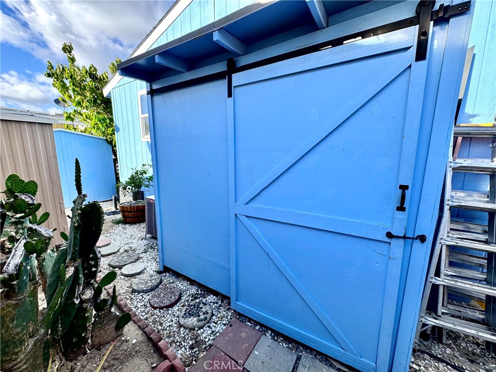 122 Colombo Lane, Unit 77 Tustin, CA 92780 - Photo 43 of 60 LARGE STORAGE SHED