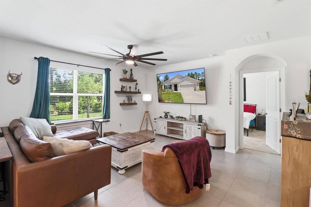 660 Hickory Course Loop Ocala, FL 34472 - Photo 16 of 45 a living room with furniture and a large window