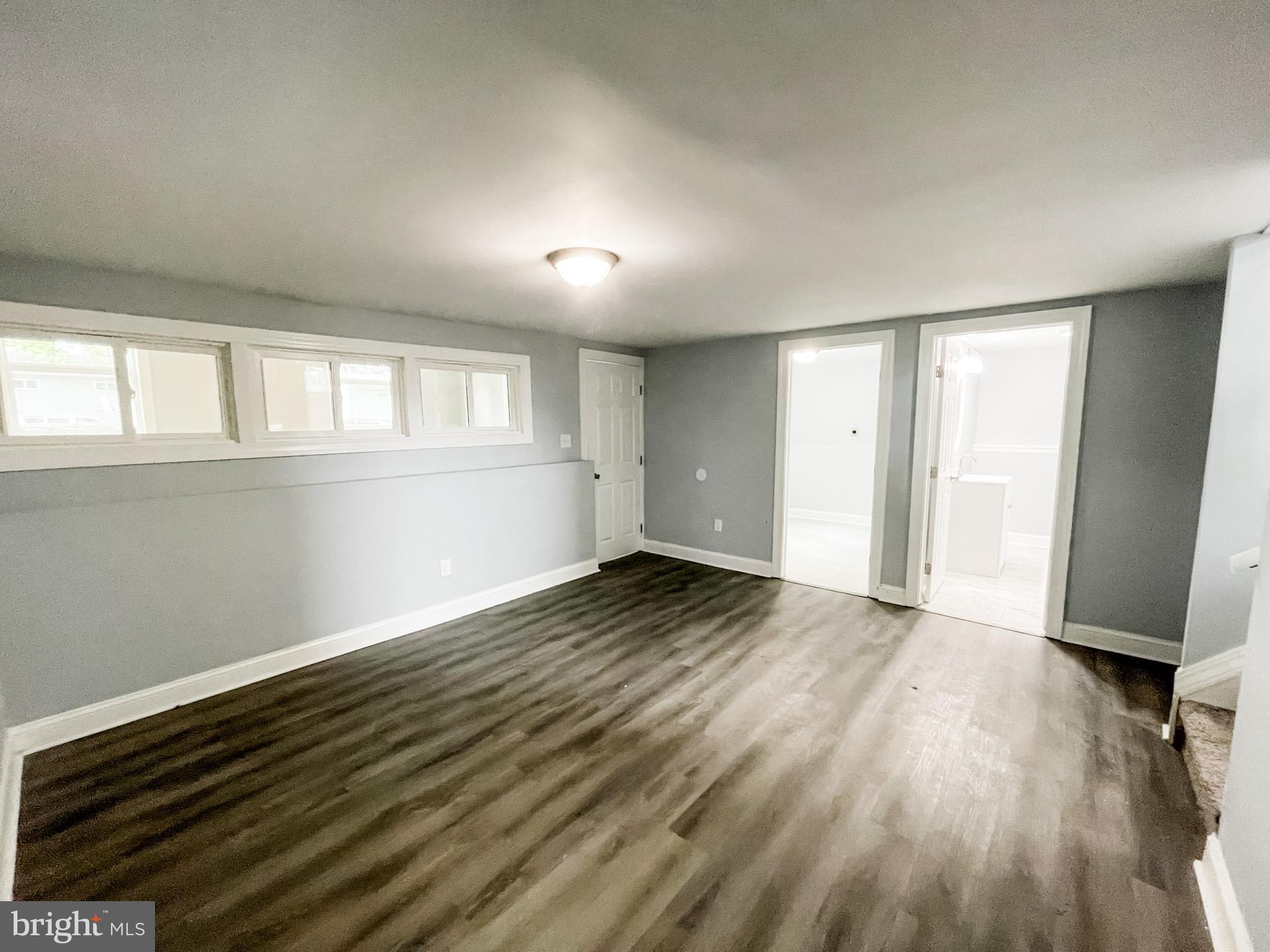 34 Marlyn Road Newark, DE 19713 - Photo 13 of 32 an empty room with wooden floor and windows