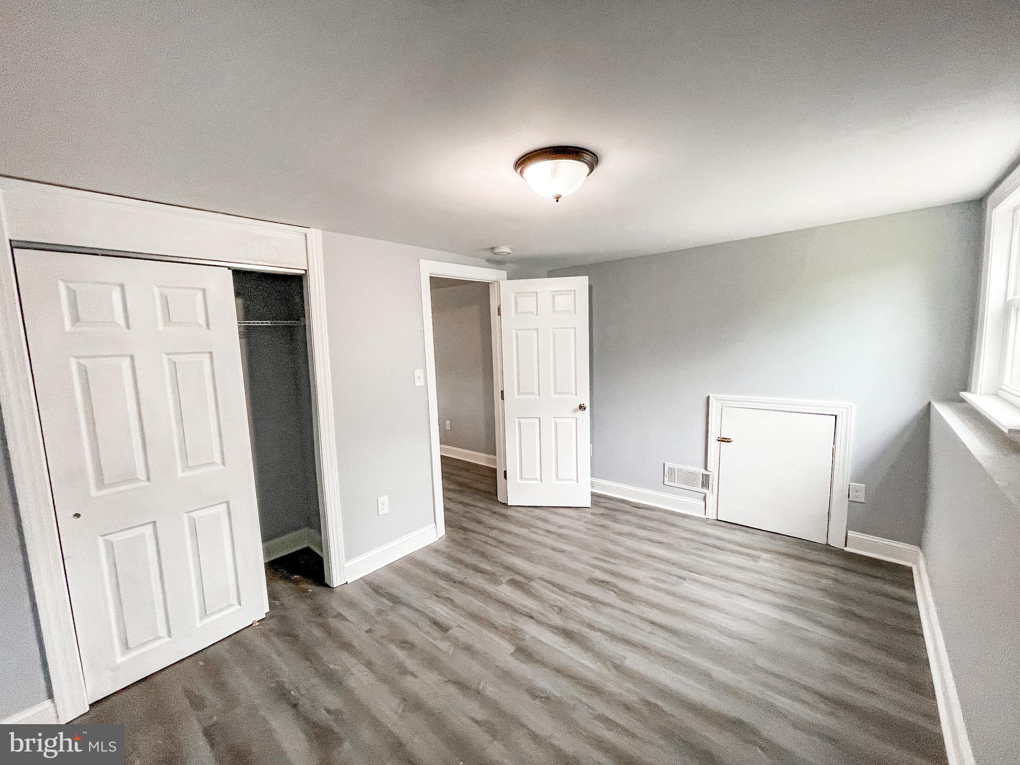 34 Marlyn Road Newark, DE 19713 - Photo 14 of 32 an empty room with wooden floor and windows