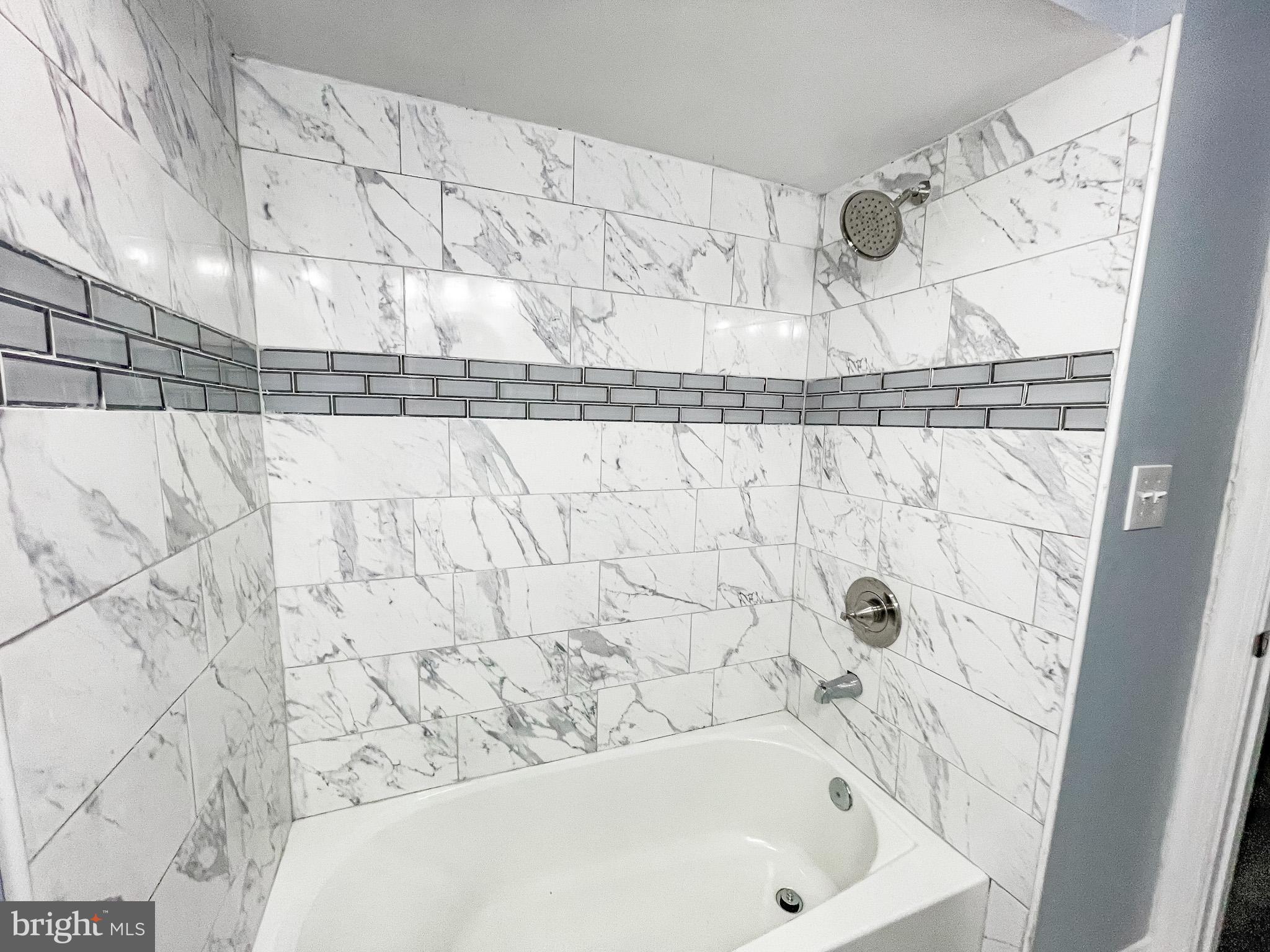 34 Marlyn Road Newark, DE 19713 - Photo 17 of 32 a bathroom with a bathtub and shower