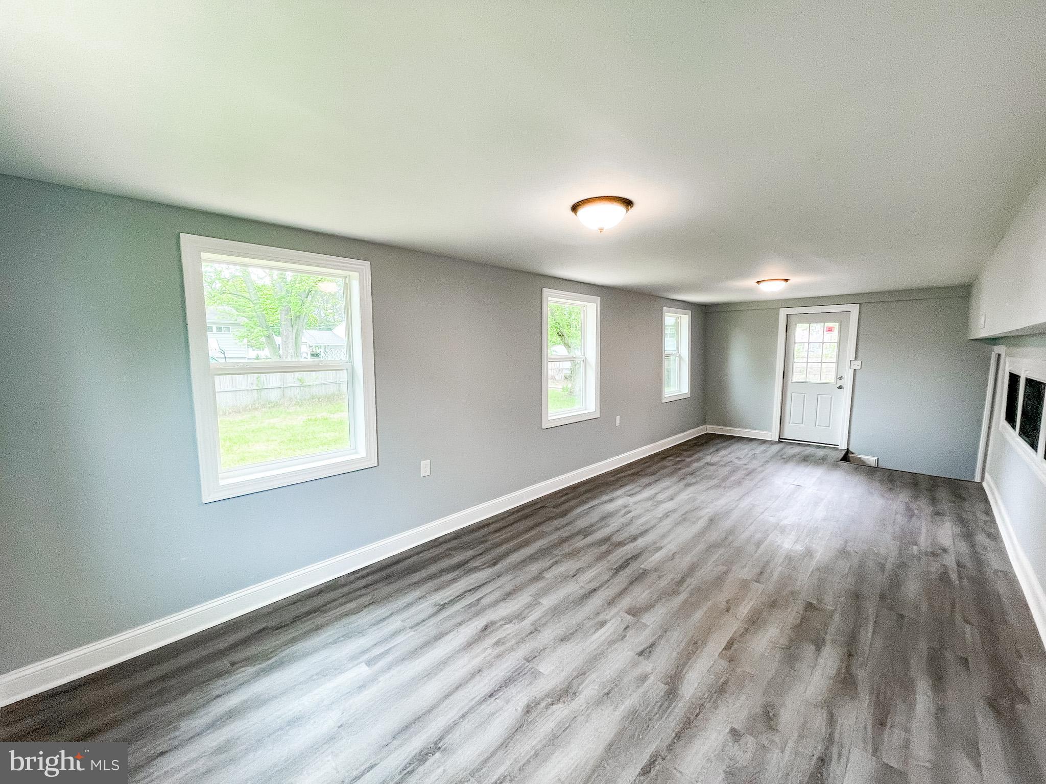 34 Marlyn Road Newark, DE 19713 - Photo 20 of 32 a view of an empty room with wooden floor and a window