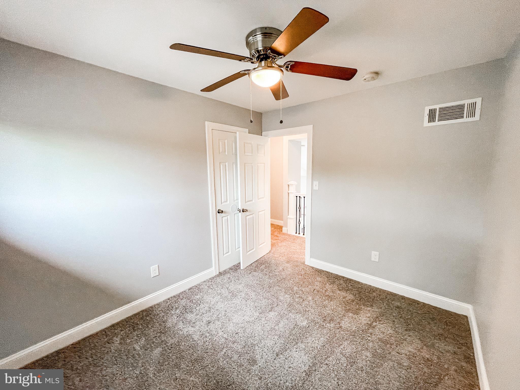34 Marlyn Road Newark, DE 19713 - Photo 23 of 32 an empty room with a window and a ceiling fan