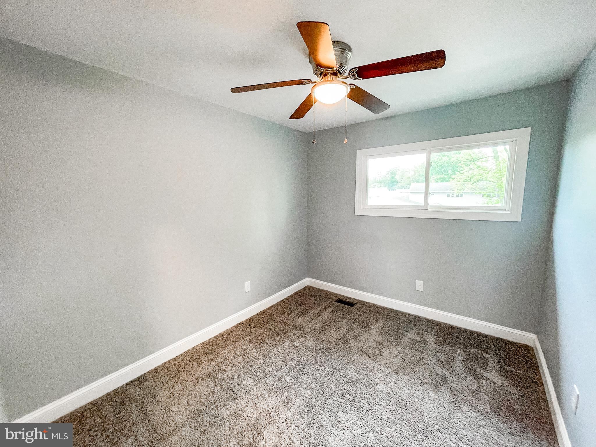 34 Marlyn Road Newark, DE 19713 - Photo 24 of 32 an empty room with window and ceiling fan