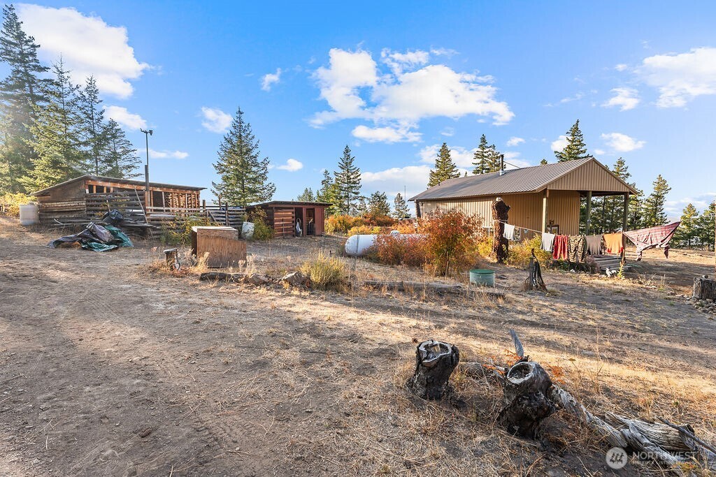 3050 East Stiss Canyon Road Wenatchee, WA 98801 - Photo 20 of 27 a view of a house with a yard and sitting area