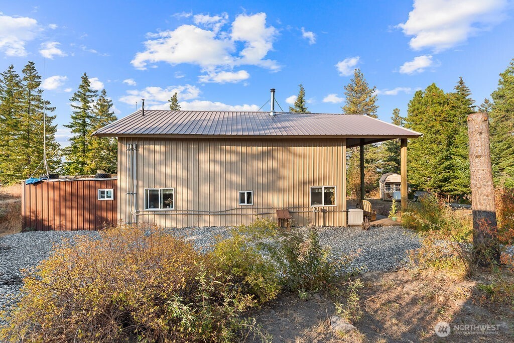 3050 East Stiss Canyon Road Wenatchee, WA 98801 - Photo 3 of 27 a view of a house with backyard and sitting area
