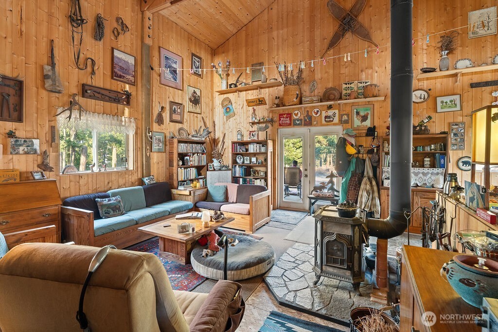 3050 East Stiss Canyon Road Wenatchee, WA 98801 - Photo 9 of 27 a living room with furniture a lamp and a floor to ceiling window