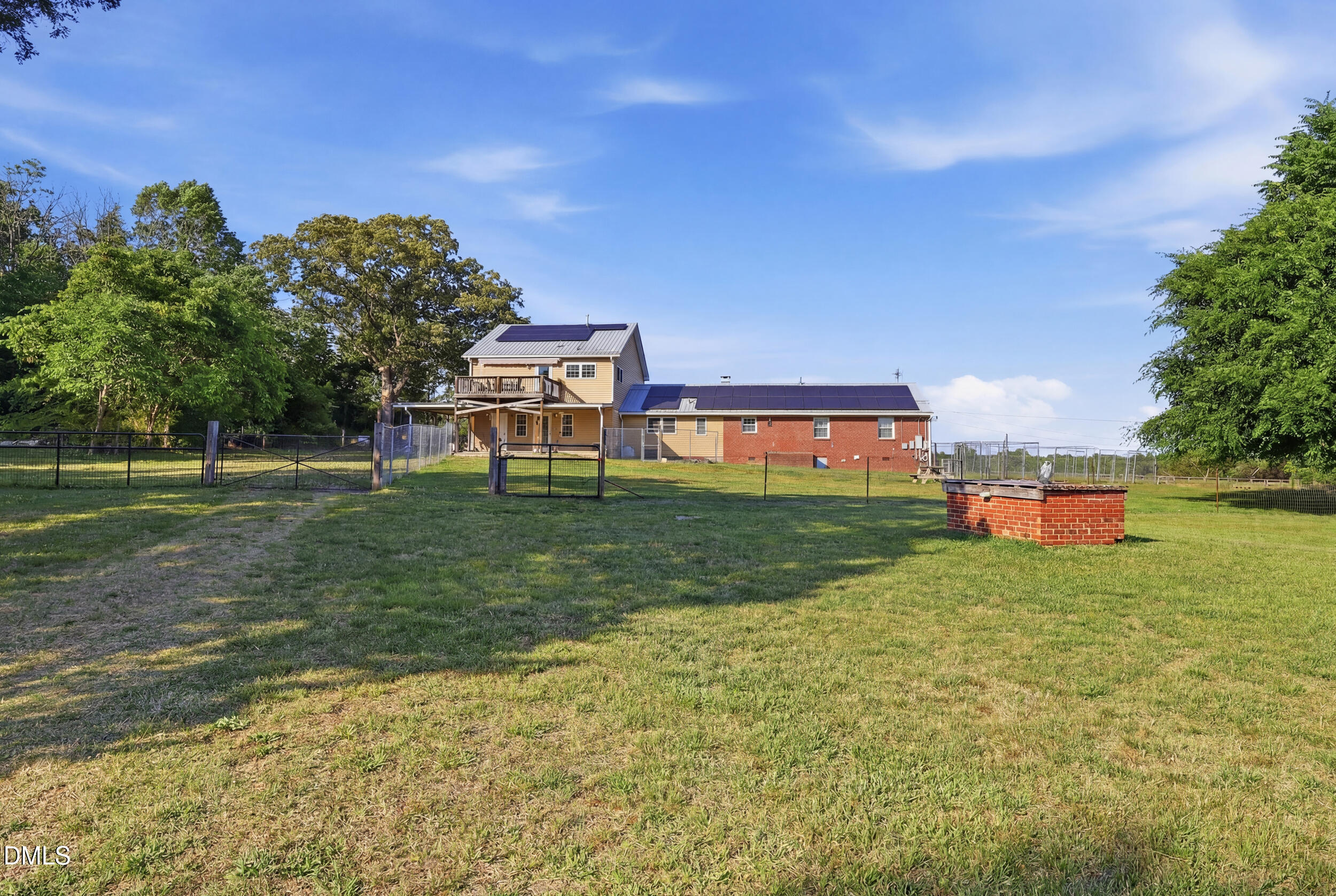 2631 South Jim Minor Road Haw River, NC 27258 - Photo 52 of 62 a backyard of a house with lots of green space