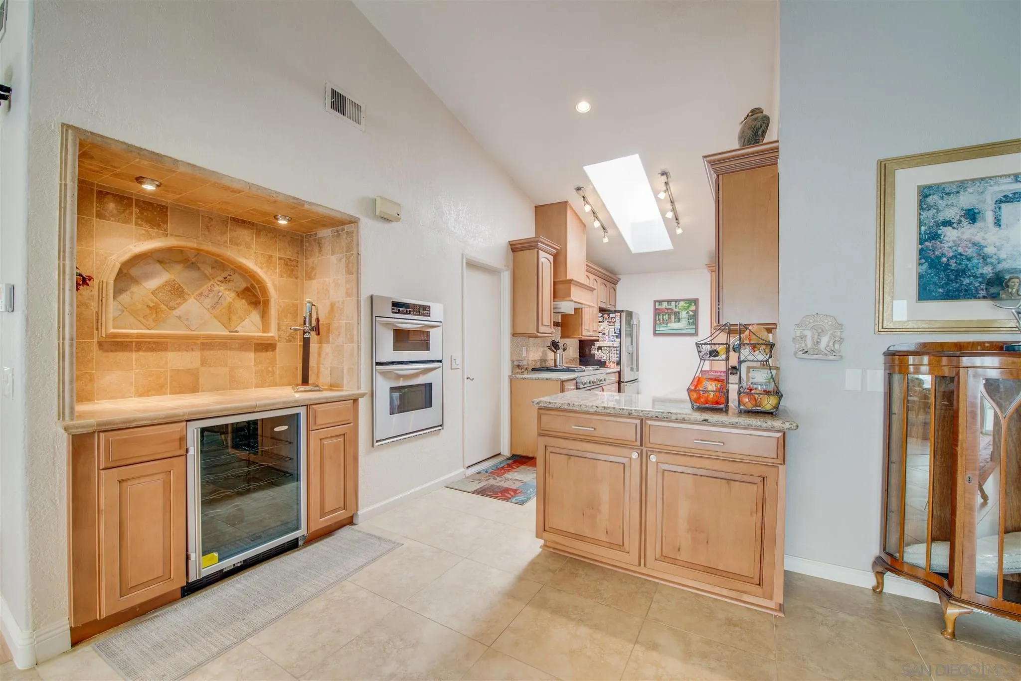 710 Anchor Way Carlsbad, CA 92008 - Photo 11 of 33 a kitchen with stainless steel appliances granite countertop a stove and a sink