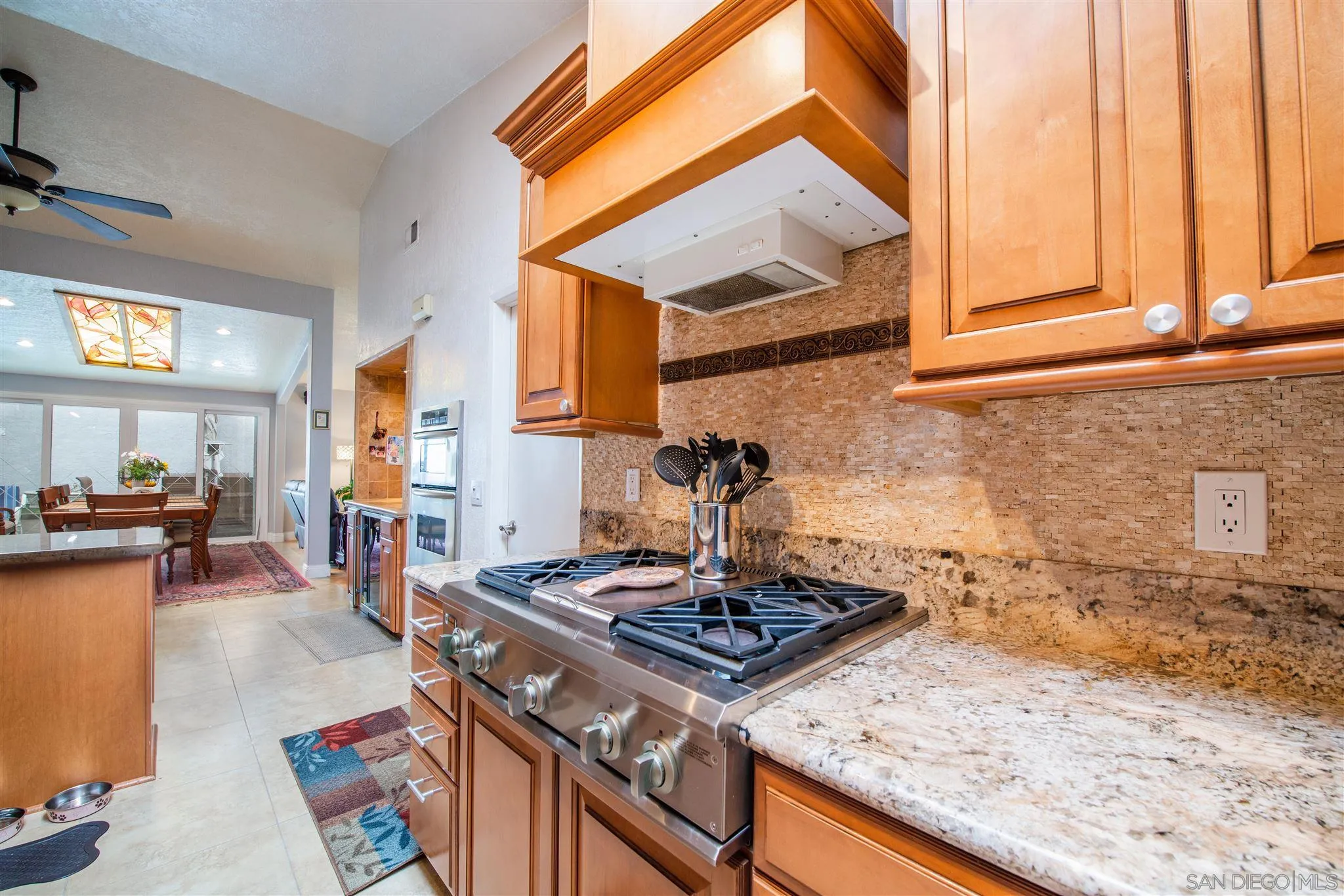 710 Anchor Way Carlsbad, CA 92008 - Photo 15 of 33 a kitchen with a stove and a sink