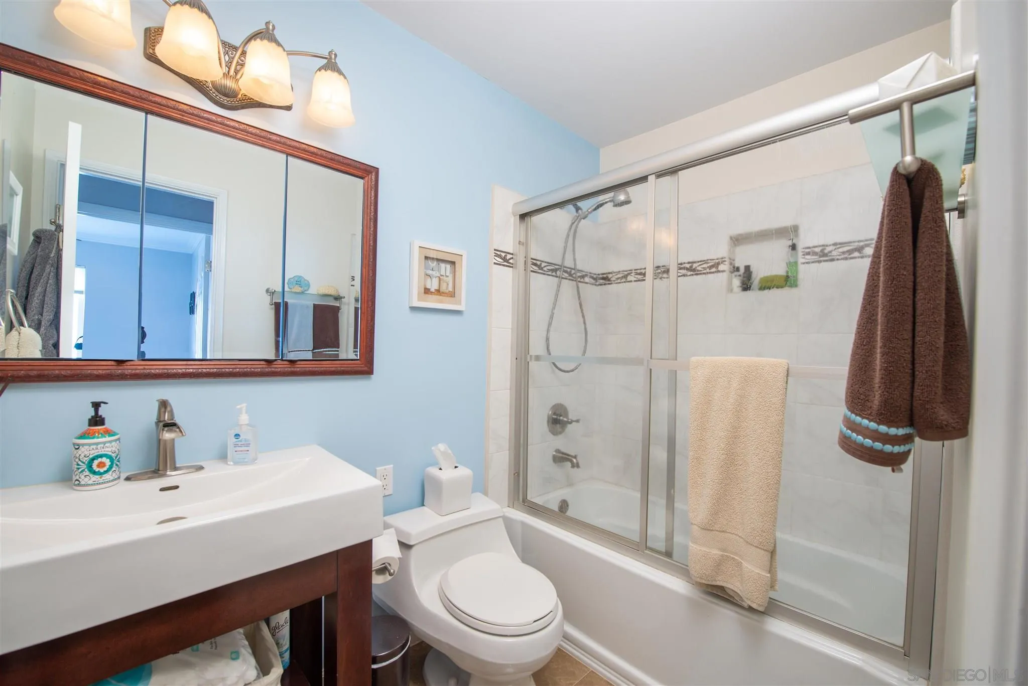 710 Anchor Way Carlsbad, CA 92008 - Photo 17 of 33 a bathroom with a sink toilet and shower