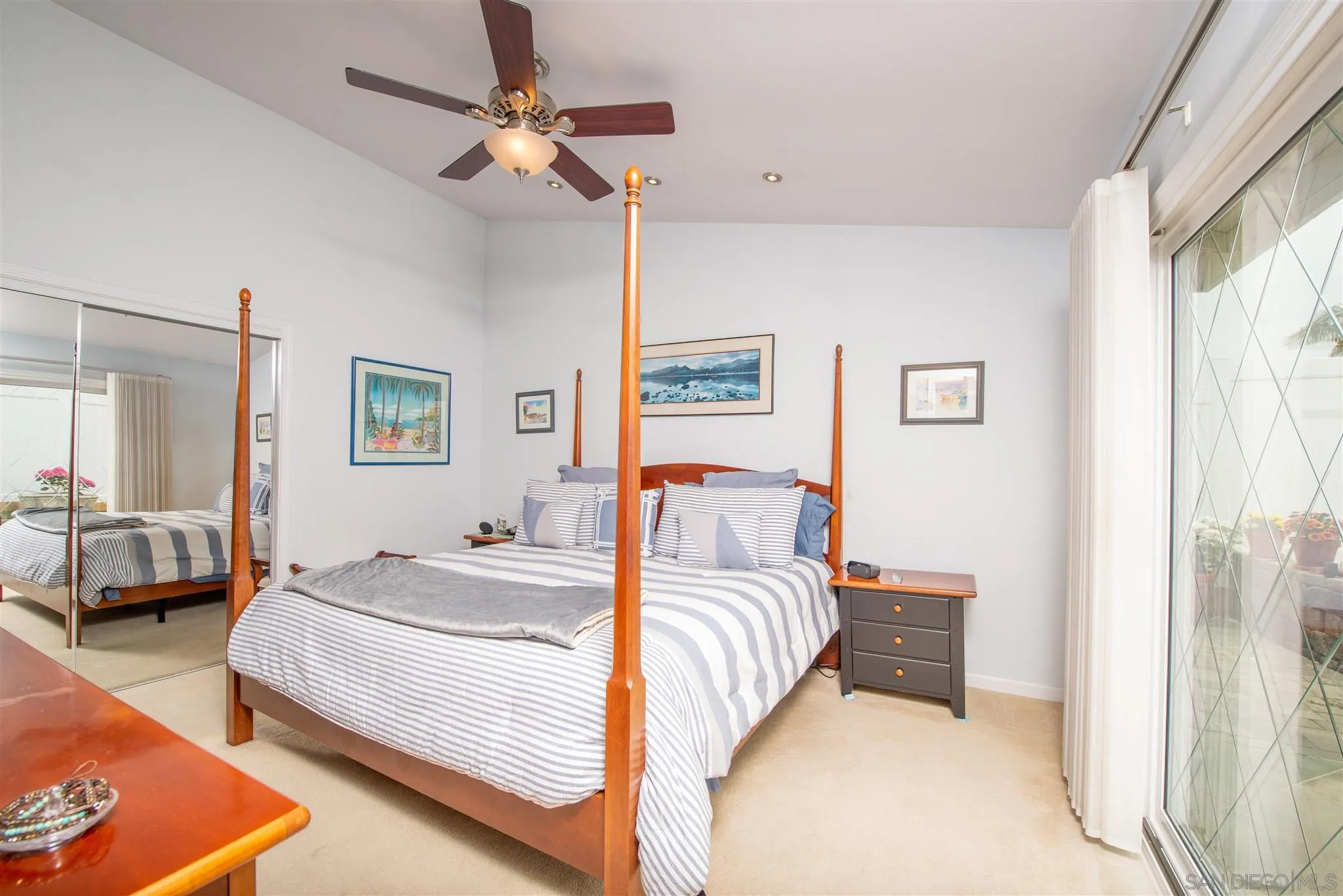 710 Anchor Way Carlsbad, CA 92008 - Photo 21 of 33 a bedroom with a bed lamp and a large window