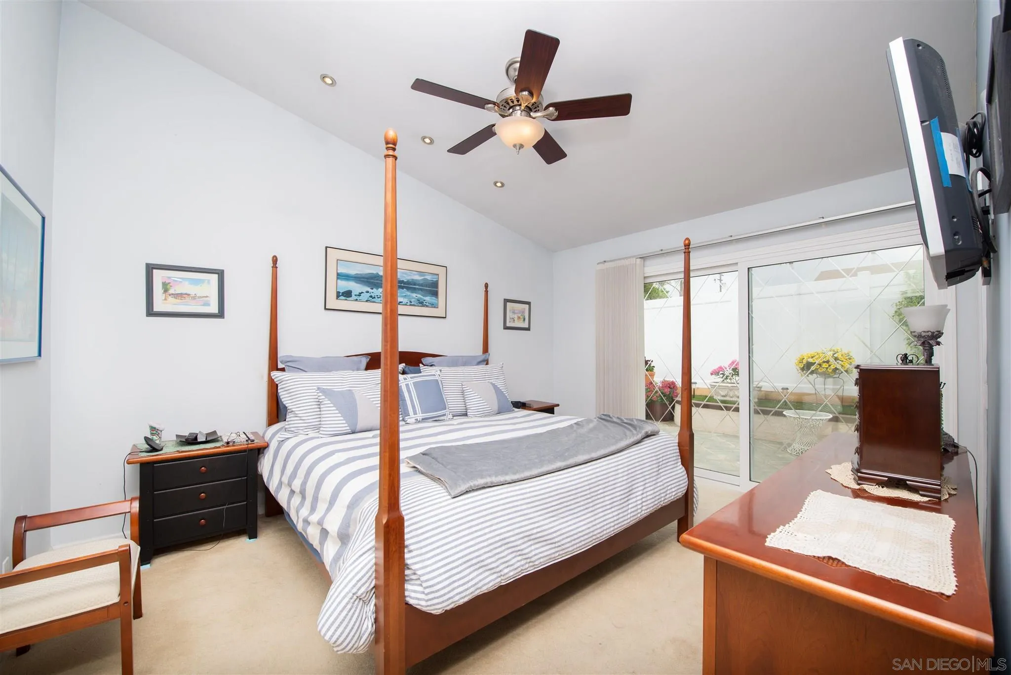 710 Anchor Way Carlsbad, CA 92008 - Photo 22 of 33 a bedroom with a bed and a flat screen tv