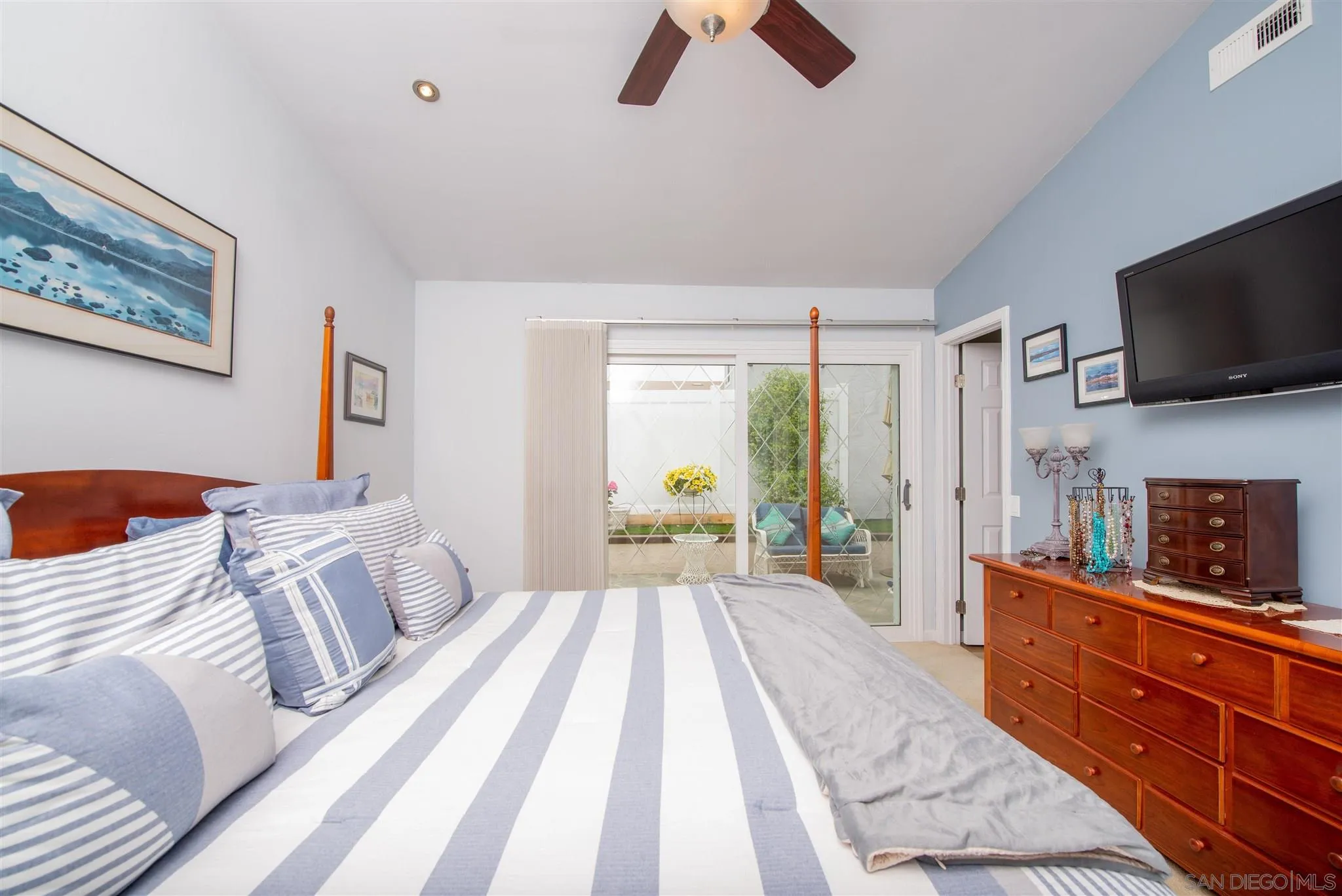 710 Anchor Way Carlsbad, CA 92008 - Photo 23 of 33 a bedroom with furniture and a flat screen tv