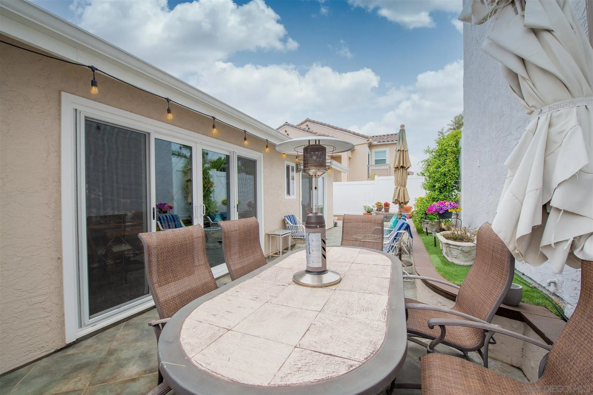 710 Anchor Way Carlsbad, CA 92008 - Photo 29 of 33 a view of an outdoor dining space with a table and chairs