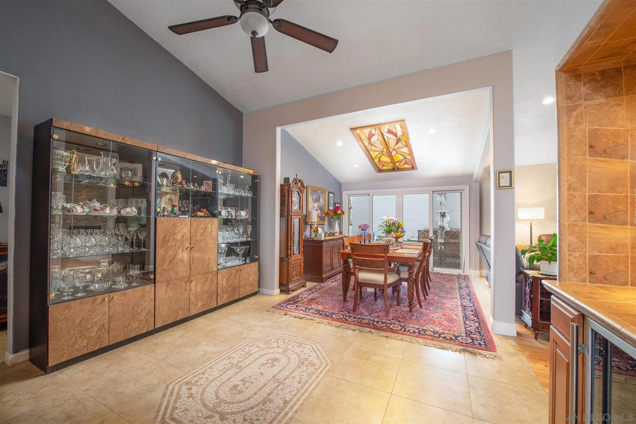 710 Anchor Way Carlsbad, CA 92008 - Photo 10 of 33 a dining room with furniture a rug and a floor to ceiling window