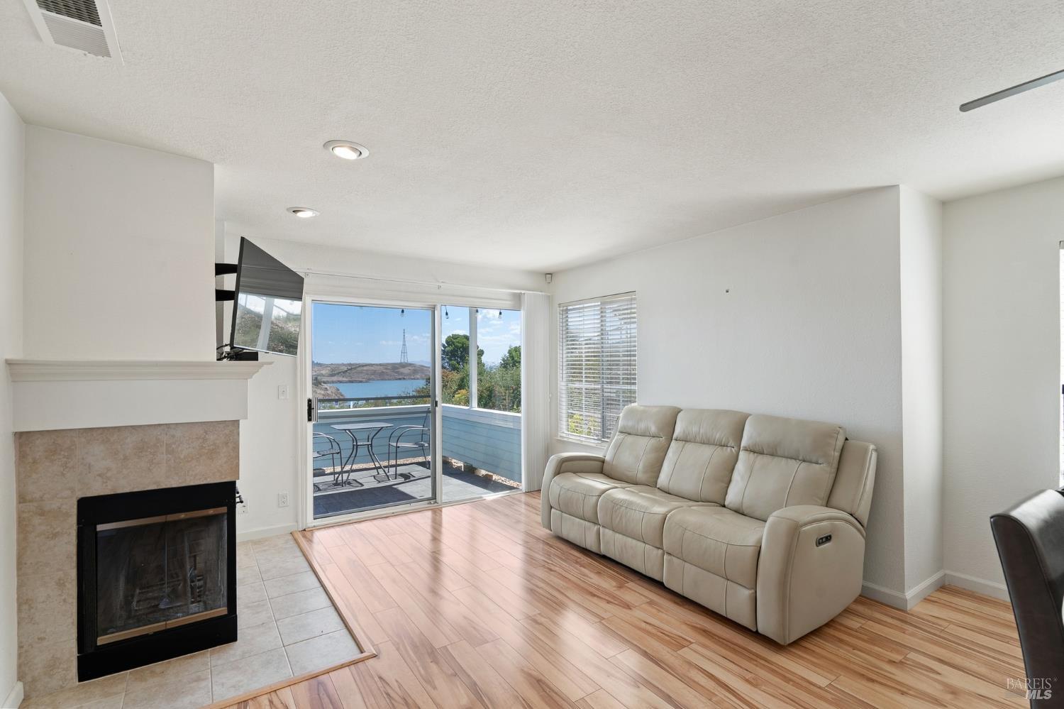 911 Point Reyes Court, Unit 6 Vallejo, CA 94591 - Photo 13 of 37 Living room with beautiful view and access to balcony.