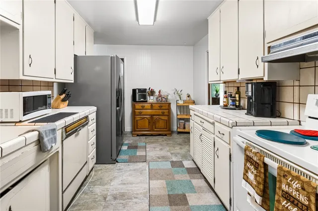 a bed sitting in a room next to a window