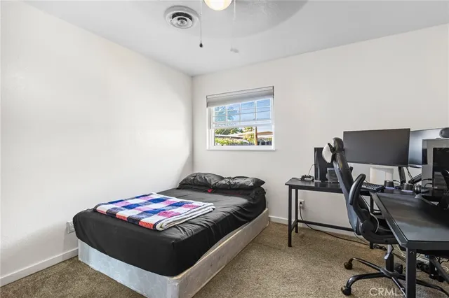 a bedroom with a bed and a cabinets