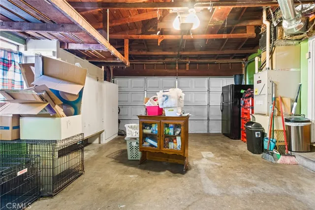 a view of a swimming pool with a bench and some trees