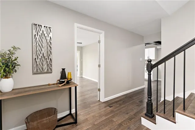 a view of front door with wooden floor